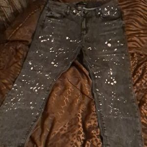 Black faded bleach splattered jeans